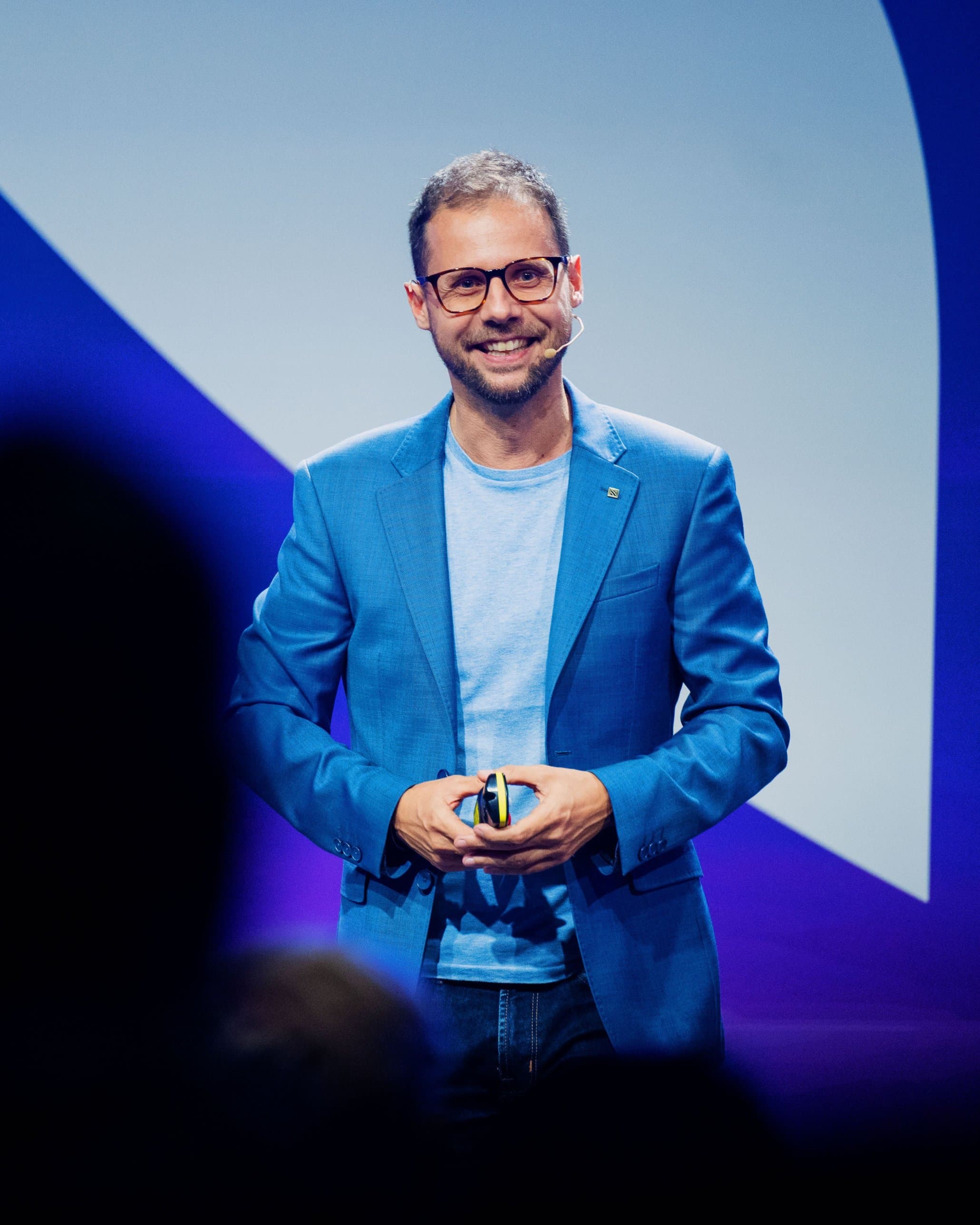 Alex Dogliotti speaking on stage